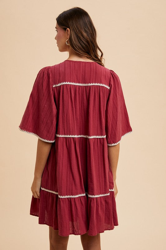 Tassel Contrast Trim Tie Neck Half Sleeve Tiered Dress – Bohemian-Inspired Dress with Tassel Details, Adjustable Tie Neck, and Tiered Design for a Flowing, Feminine Silhouette