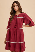 Tassel Contrast Trim Tie Neck Half Sleeve Tiered Dress – Bohemian-Inspired Dress with Tassel Details, Adjustable Tie Neck, and Tiered Design for a Flowing, Feminine Silhouette