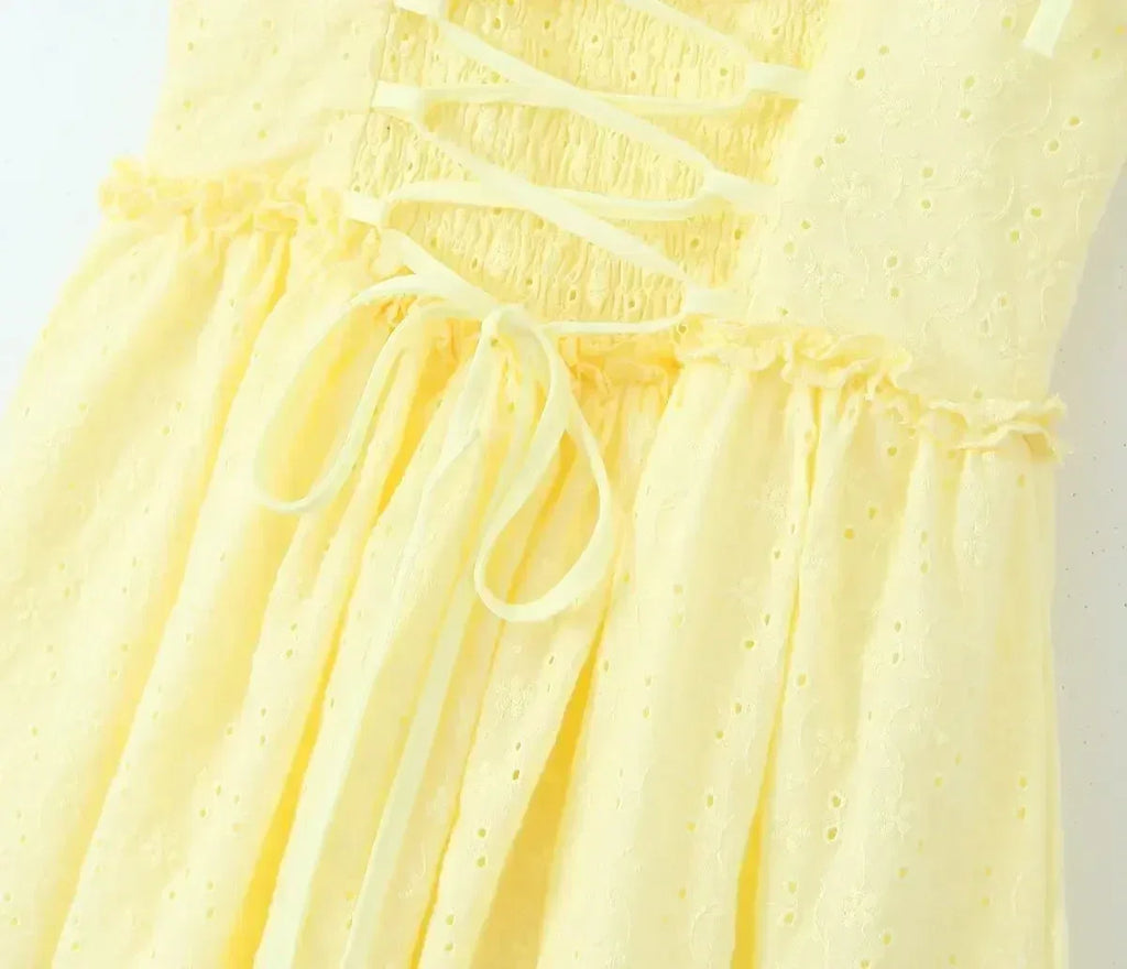 YENKYE Sexy Elegant Women Hollow Out Embroidery Yellow Sling Mini Dress Low Waist Lace Up Bandage Party Dresses Birthday Robe