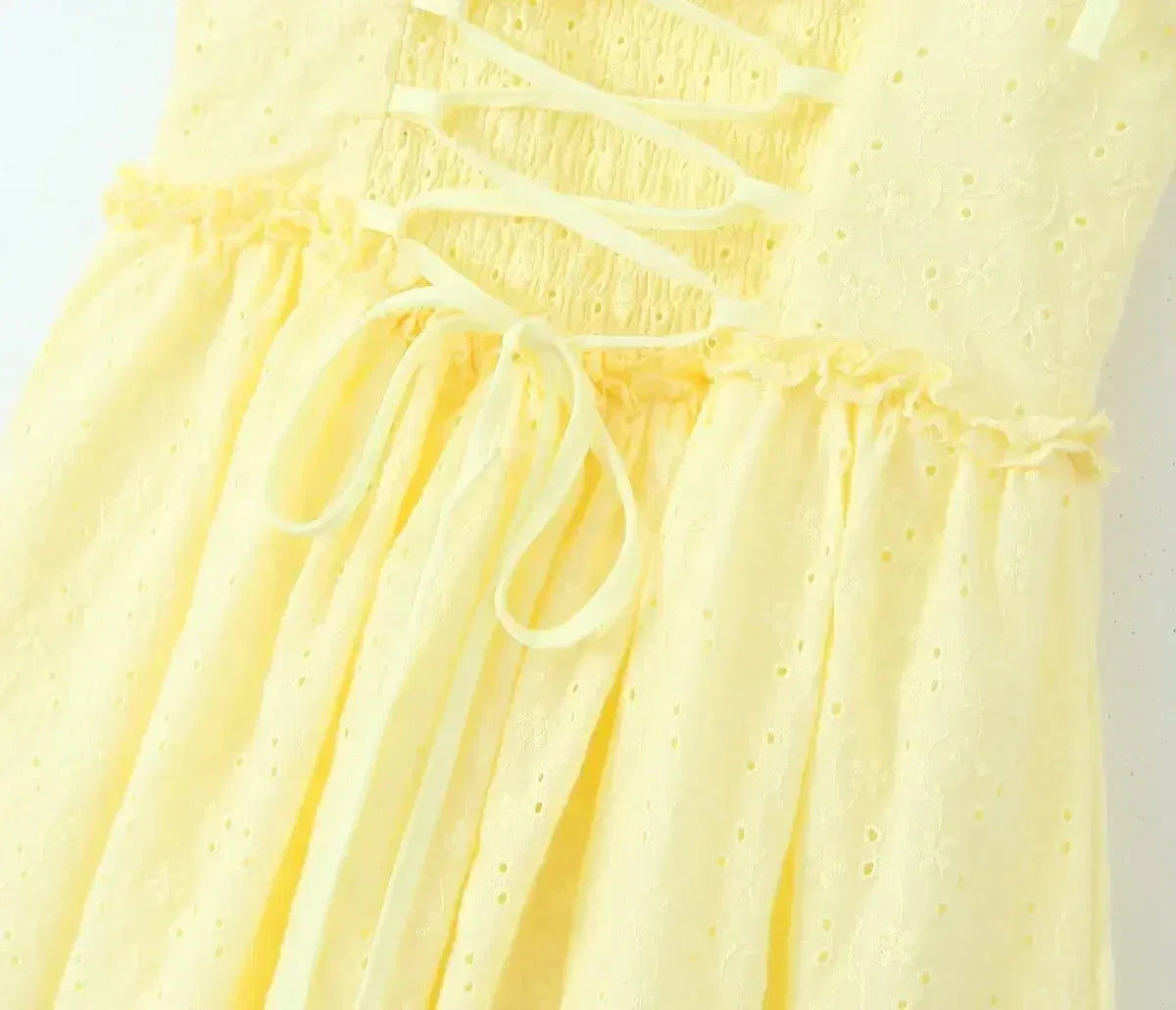 YENKYE Sexy Elegant Women Hollow Out Embroidery Yellow Sling Mini Dress Low Waist Lace Up Bandage Party Dresses Birthday Robe