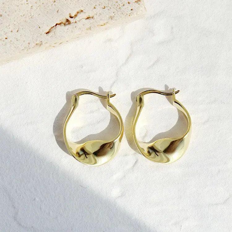 MAC063 Filled Twisted Ear Buckle Earrings